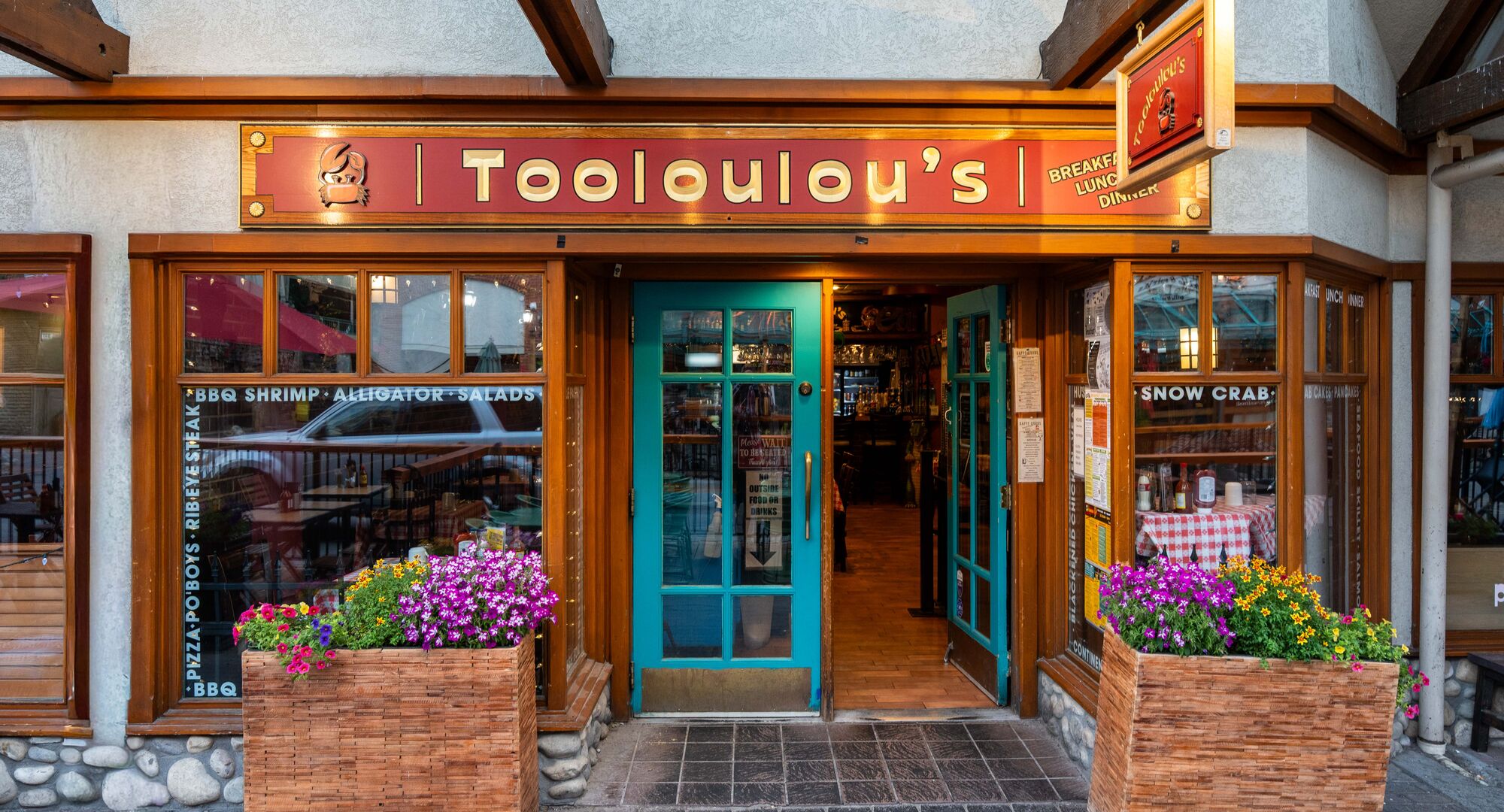 Storefront view of the restaurant Tooloulou's in Banff town in Banff National Park