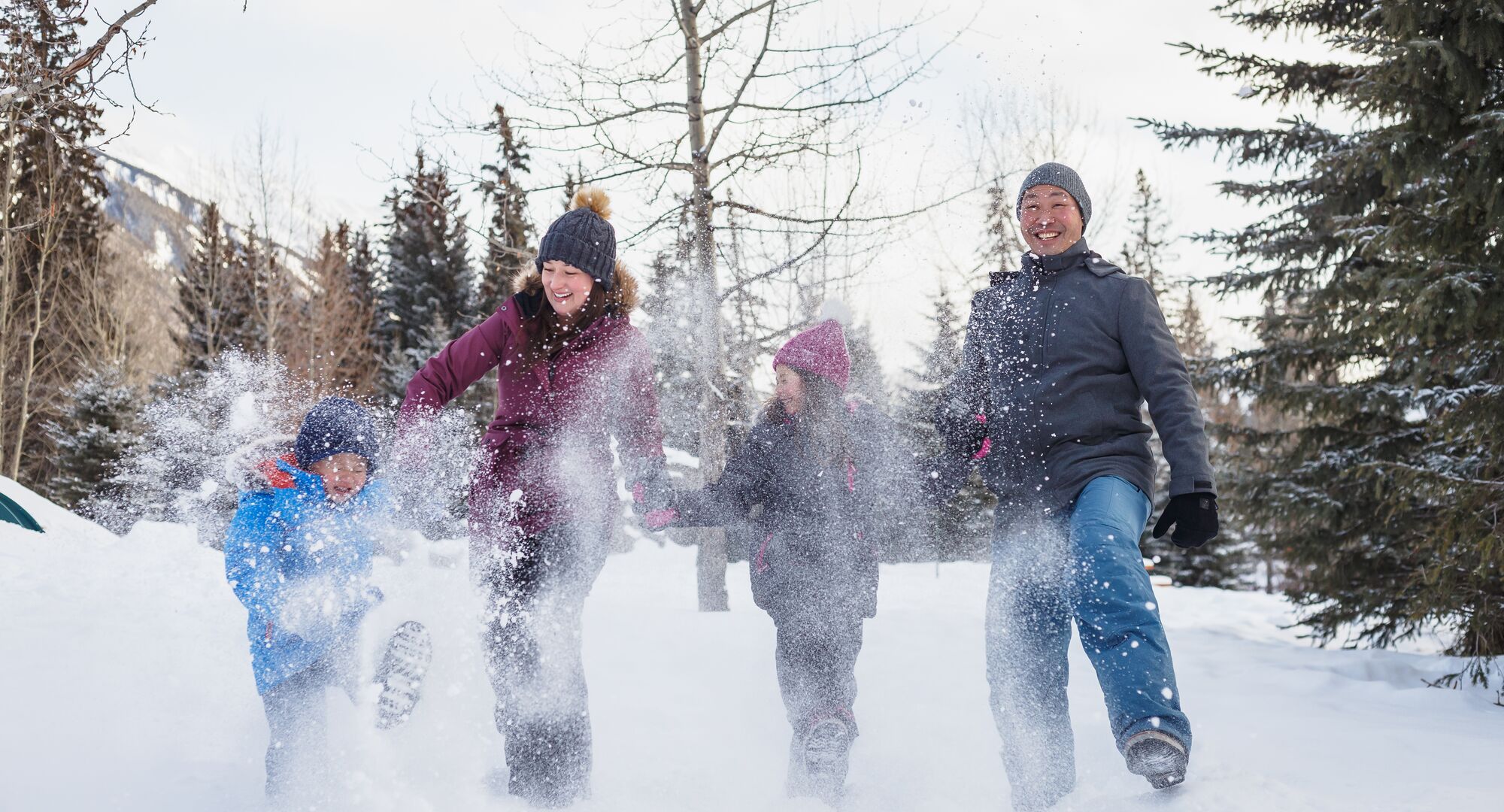 A family enjoying the snow in Central Park during the SnowDays Festival