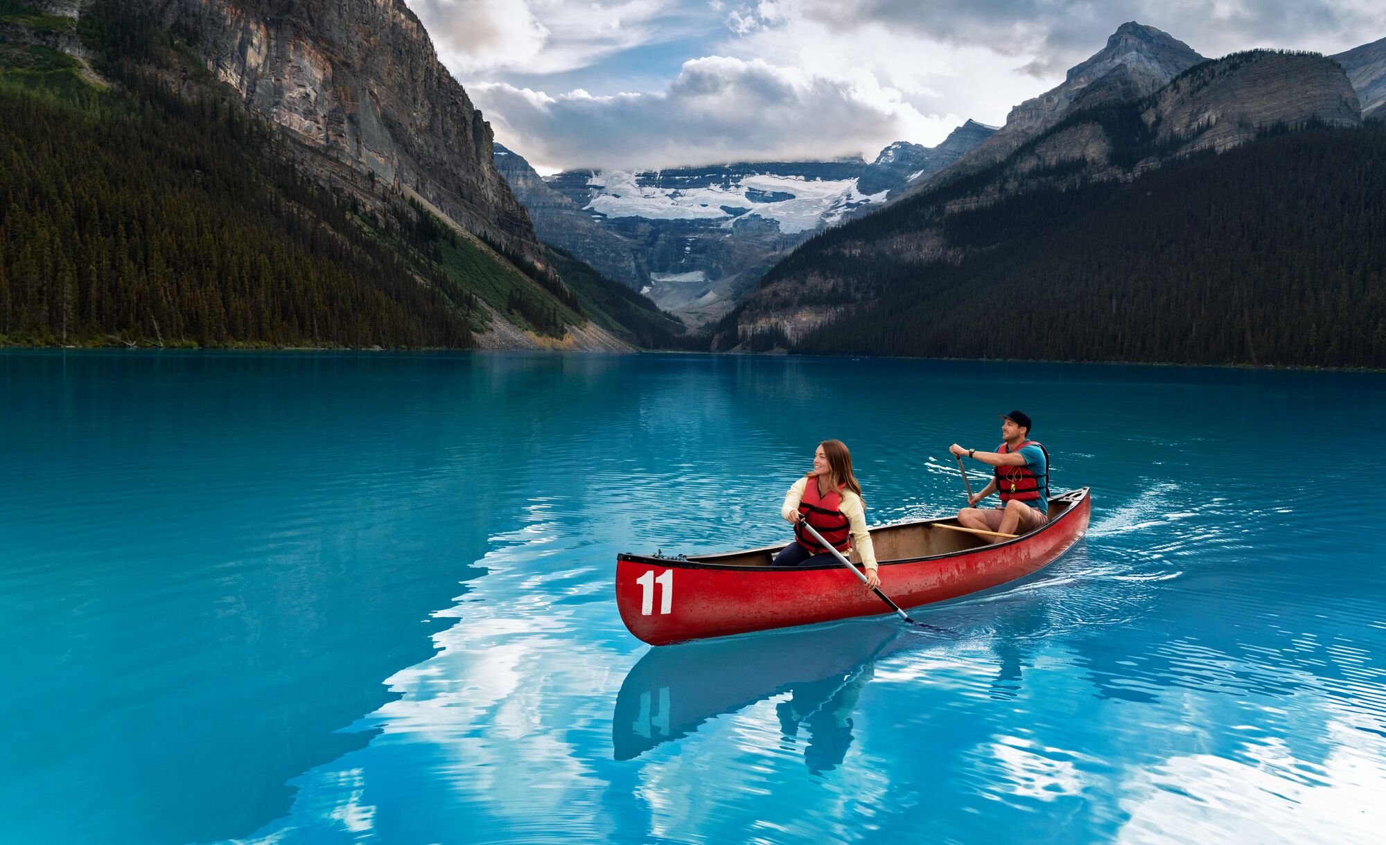 Two canoers on Lake Louise in Banff National Park.