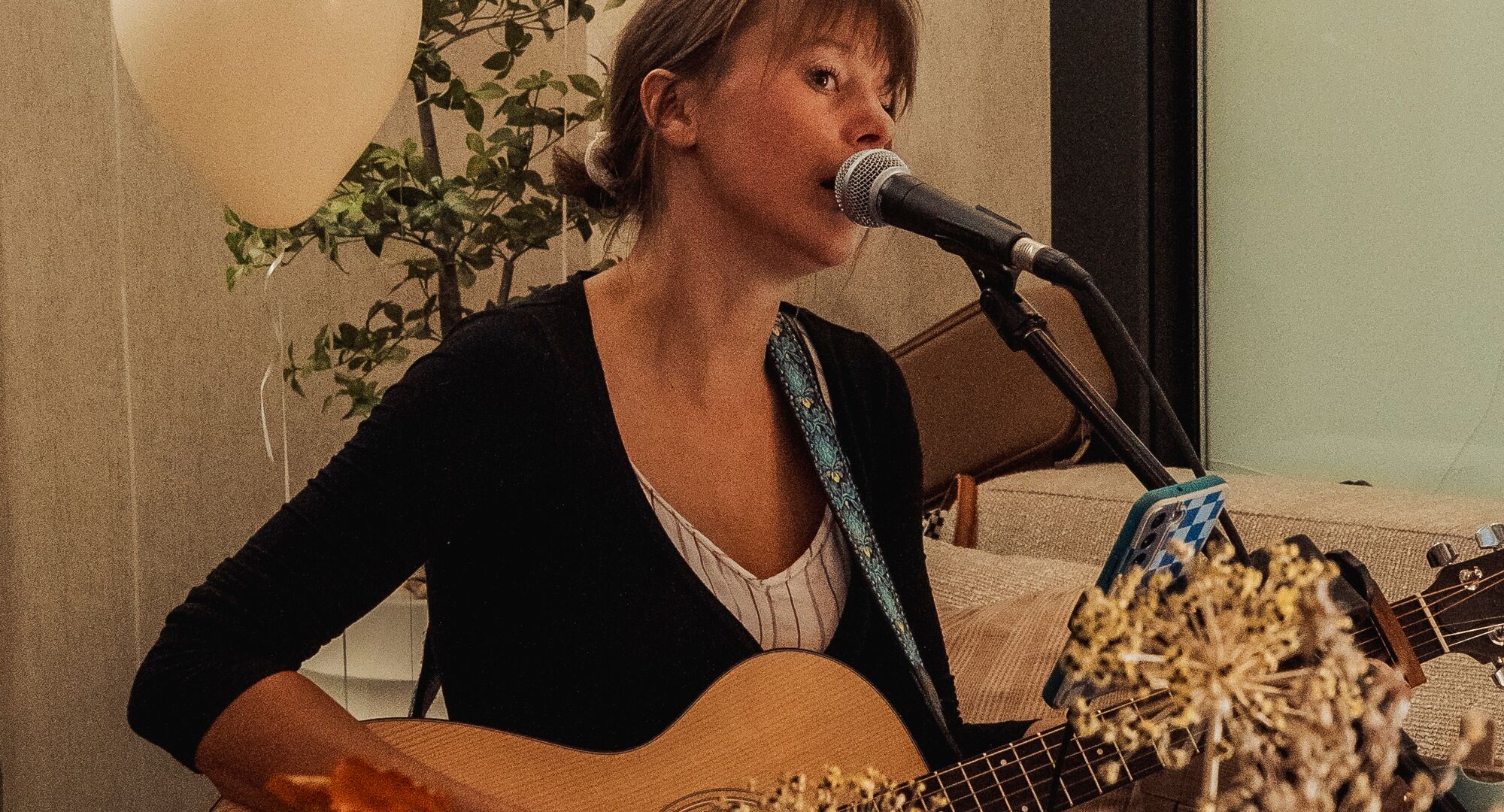 Kerry Hunter singing in the Kenrick Hotel lobby