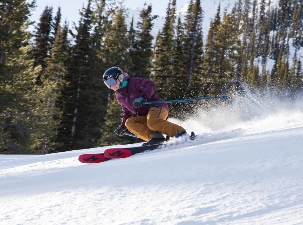 A skier races down Abracadabra run at Mt. Norquay Ski Resort in Banff National Park.