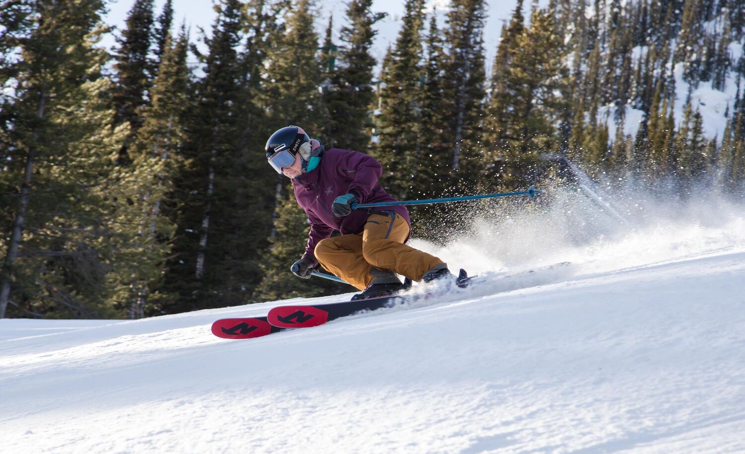 A skier races down Abracadabra run at Mt. Norquay Ski Resort in Banff National Park.