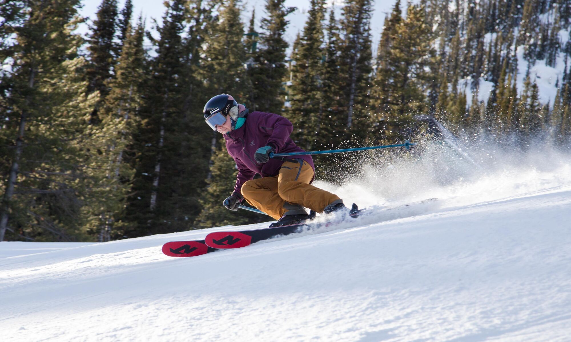 A skier races down Abracadabra run at Mt. Norquay Ski Resort in Banff National Park.