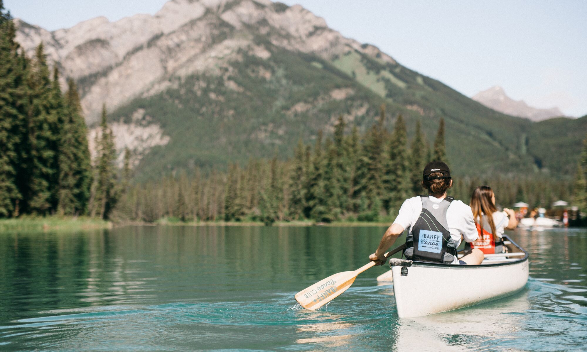 Two people canoeing on the Bow River in Banff National Park