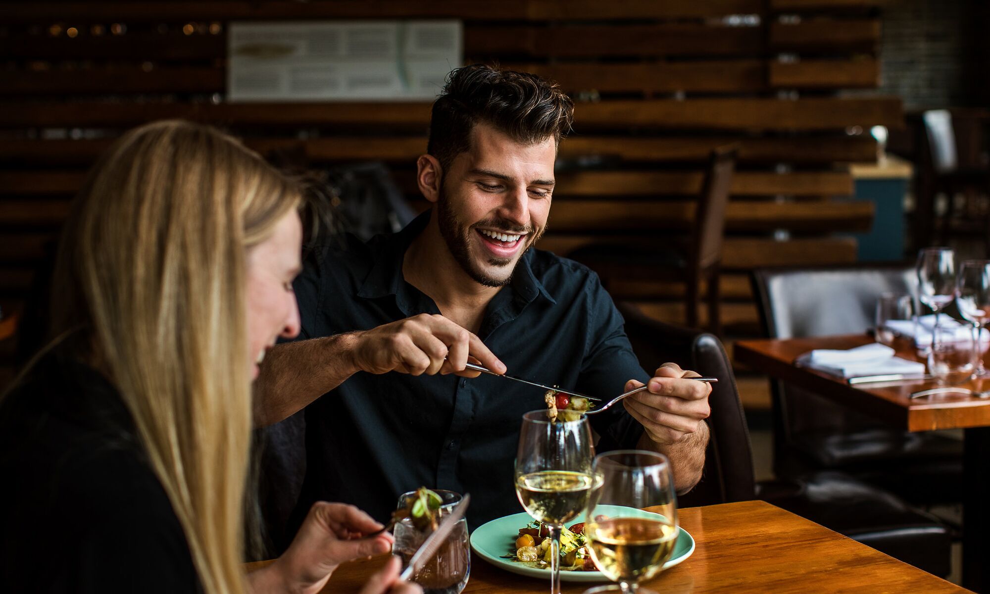 A couple dines at the Juniper Bistro in Banff National Park.