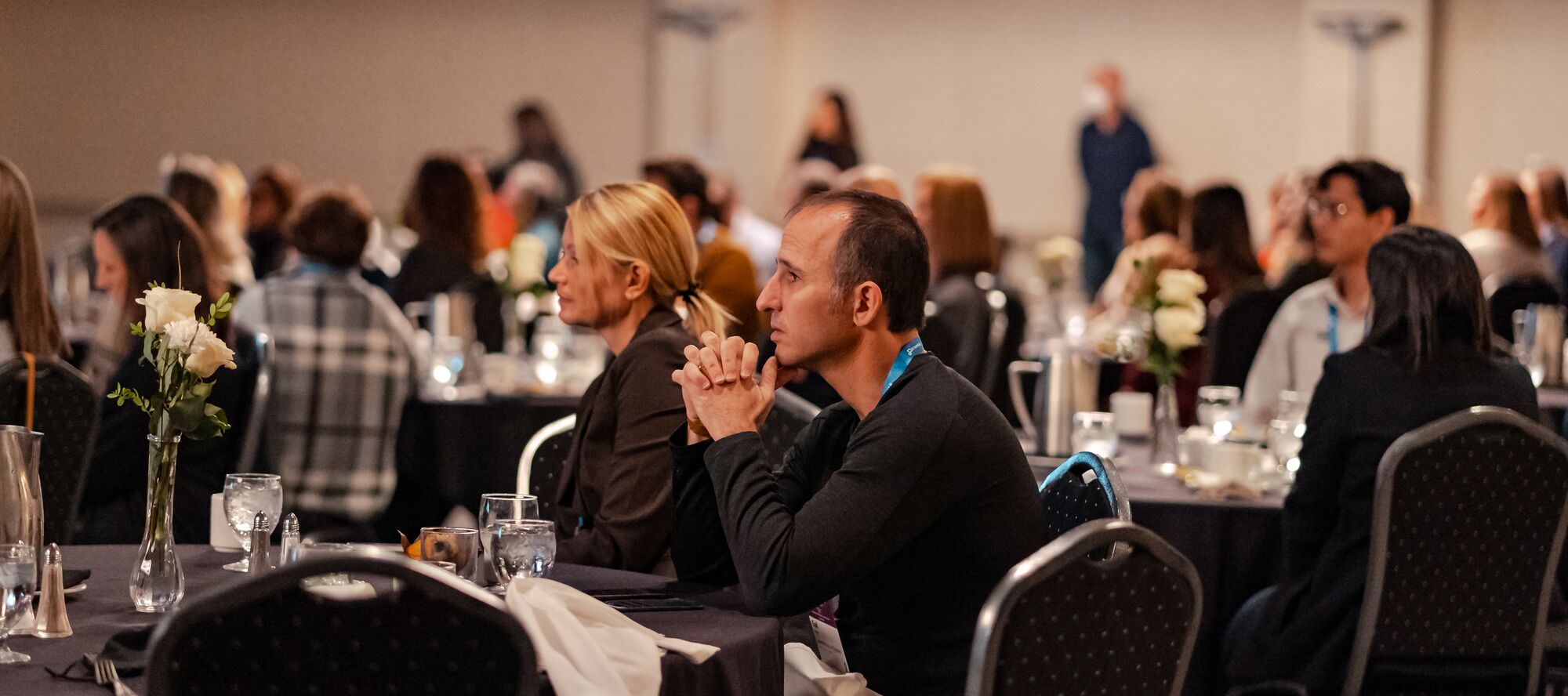 People sitting in a meeting room a listening to a presentation in Banff National Park. 