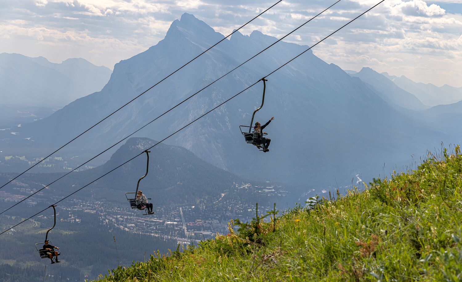 People enjoying the summer sightseeing gondola at Mt Norquay on a beautiful day in Banff National Park.