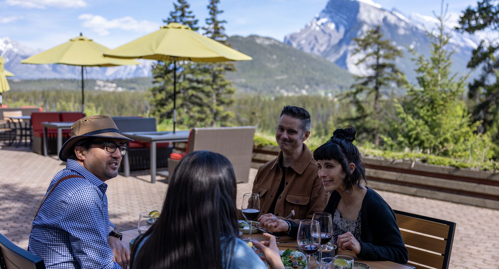 Friends enjoy food and drinks with a view at the Juniper Bistro