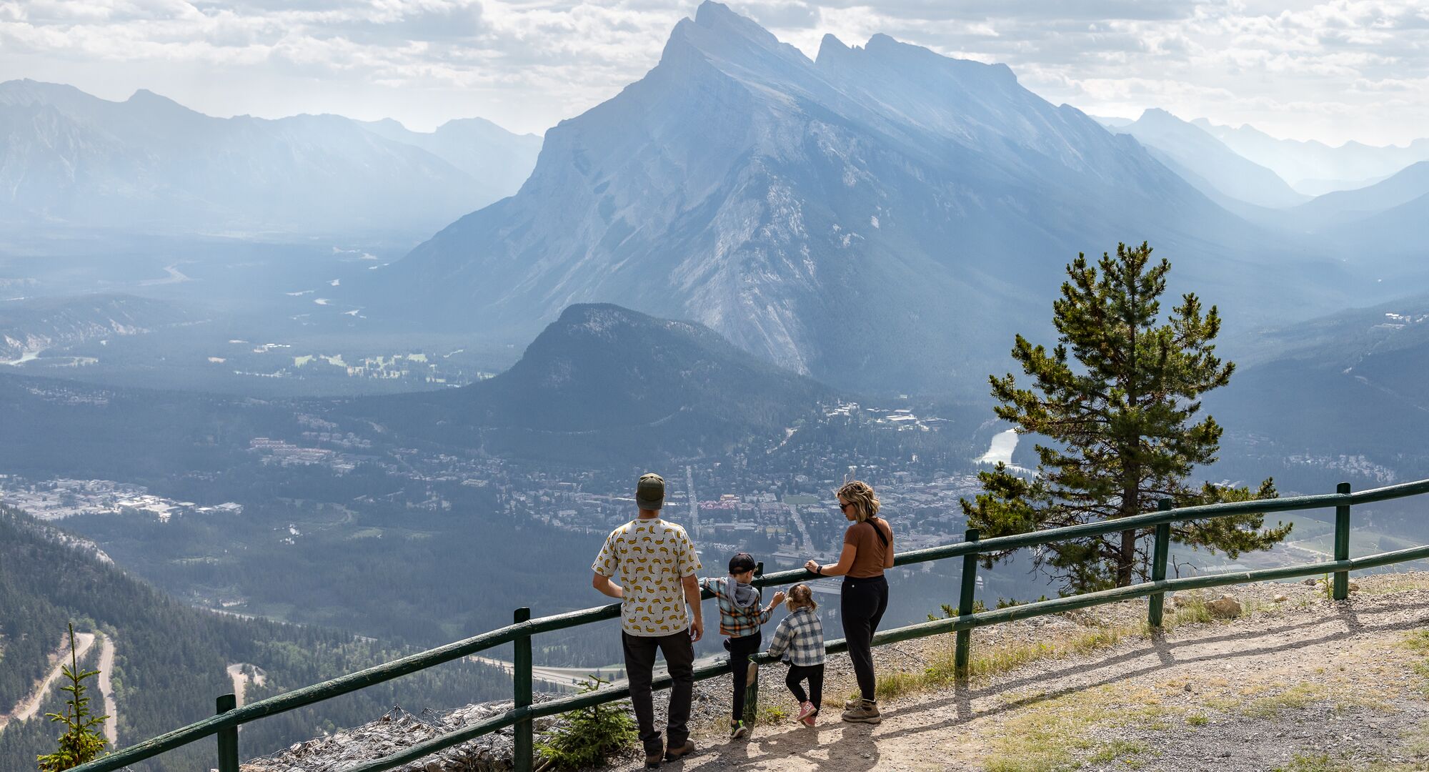 People enjoying the summer sightseeing gondola at Mt Norquay on a beautiful day in Banff National Park.