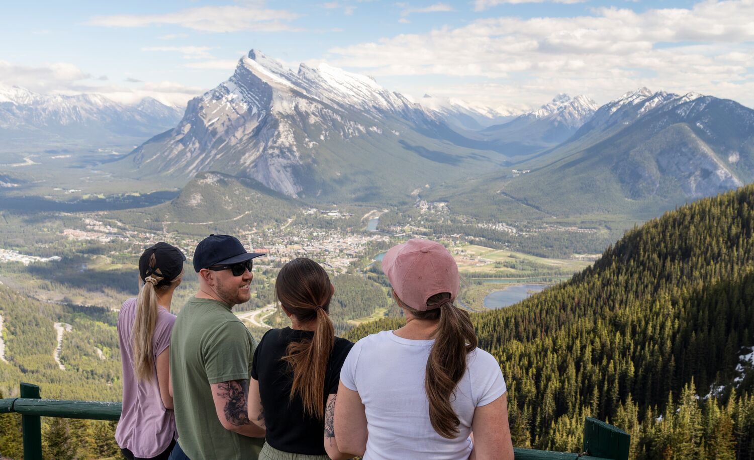 Four people at the Norquay sightseeing chairlift viewpoint, a popular spot in Banff National Park in August