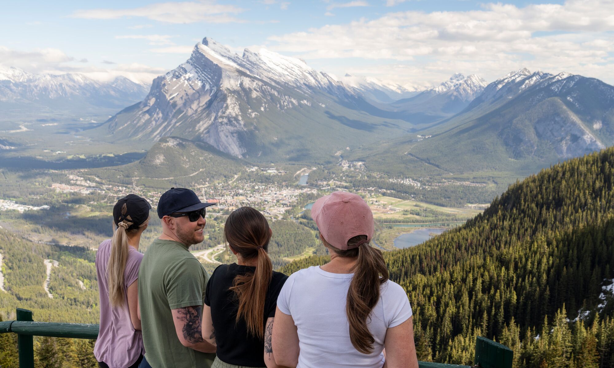 Four people at the Norquay sightseeing chairlift viewpoint, a popular spot in Banff National Park in August