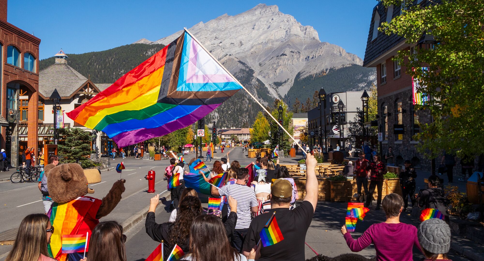 People celebrating Banff Pride on Banff Ave.
