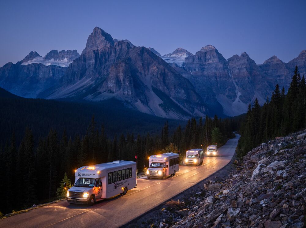 Shuttles on the road to Moraine Lake in Banff National Park.