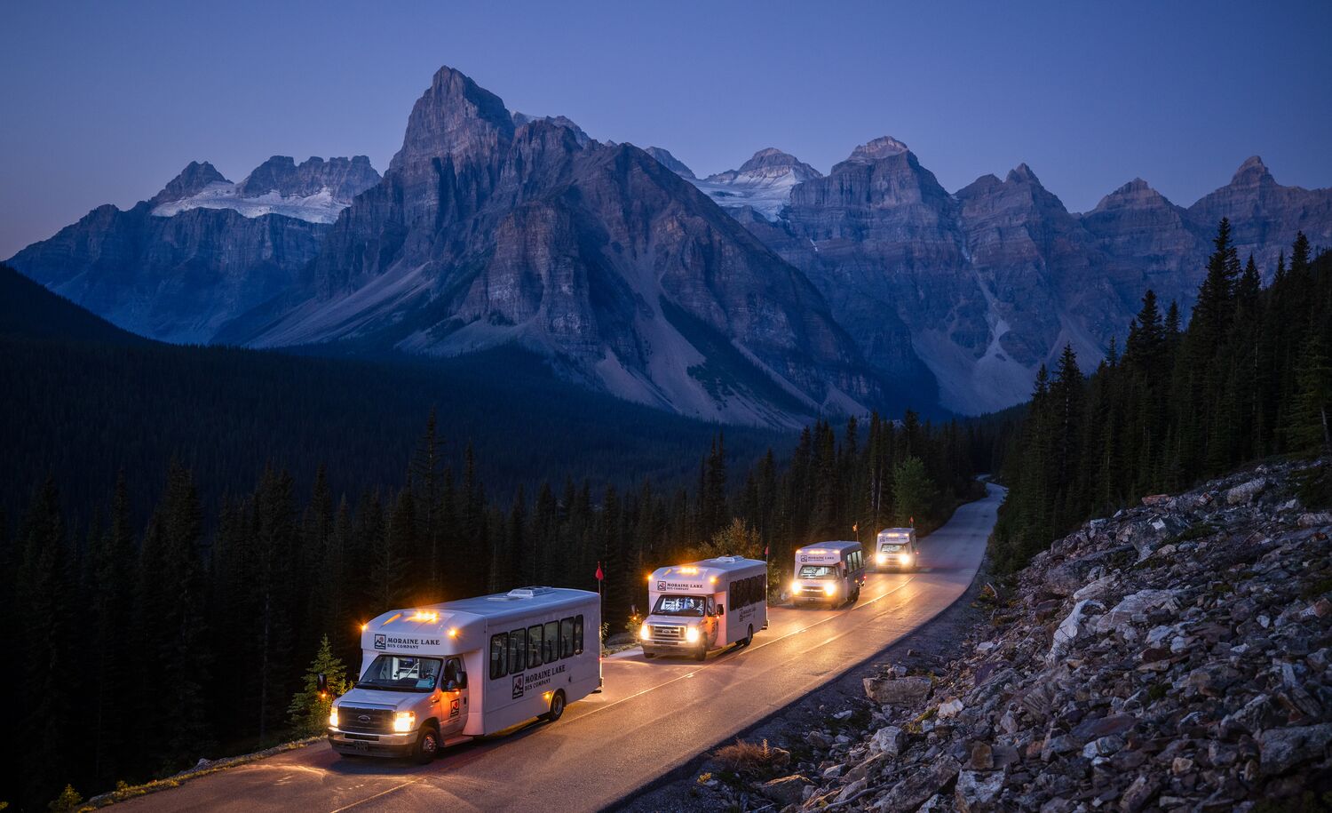 Shuttles on the road to Moraine Lake in Banff National Park.