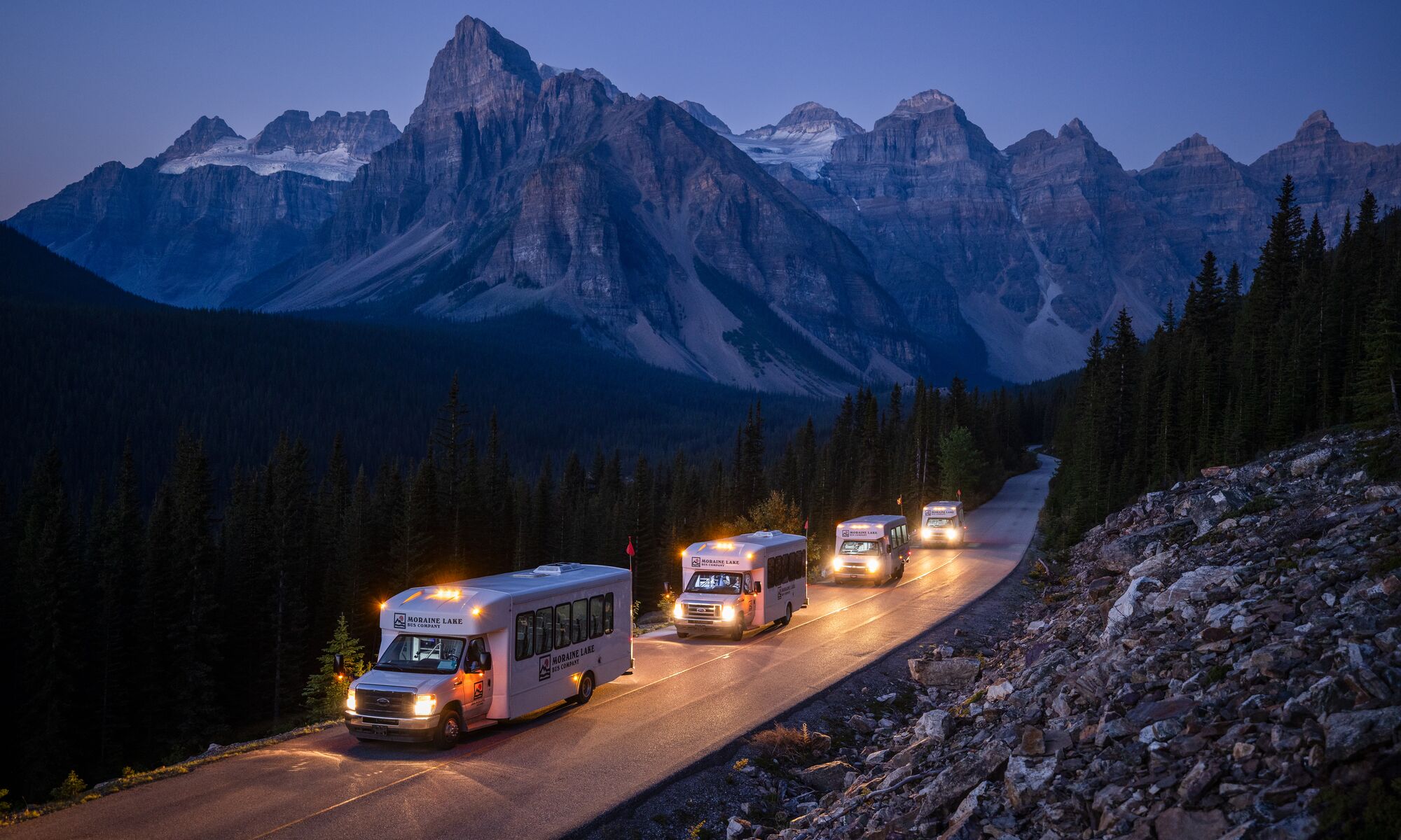 Shuttles on the road to Moraine Lake in Banff National Park.