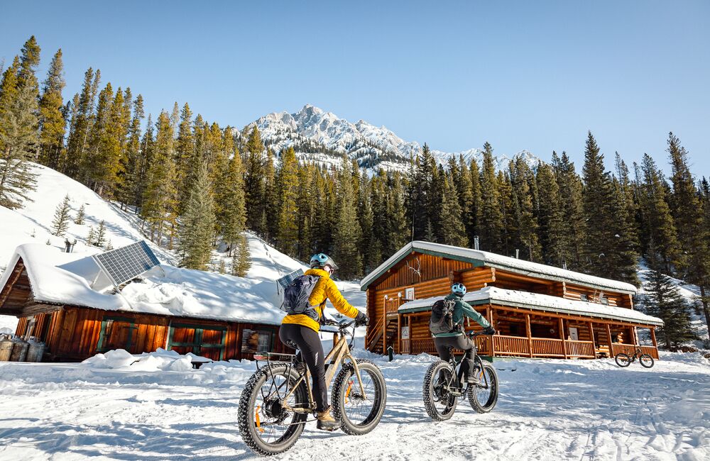 Two people on a fat biking tour through Banff National Park with bikescape