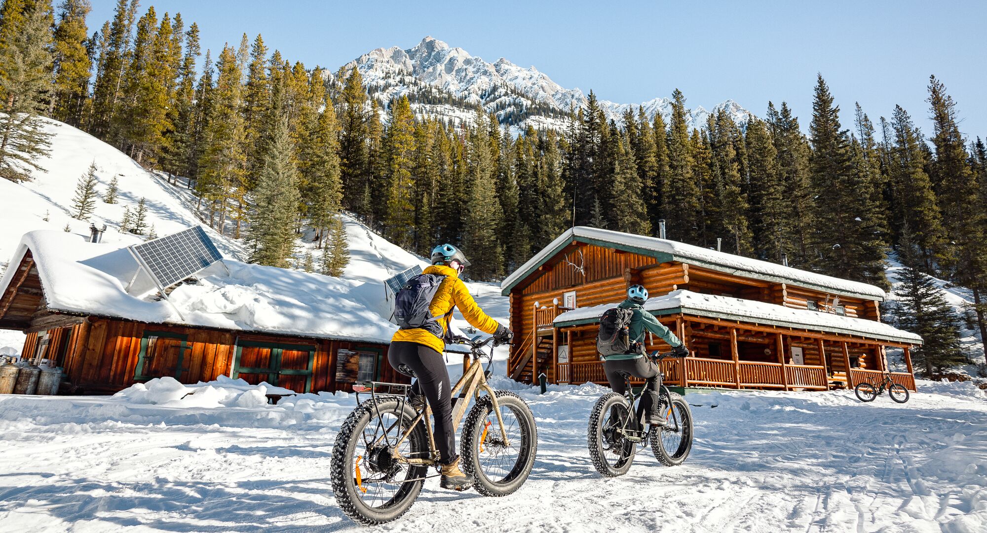 Two people on a fat biking tour through Banff National Park with bikescape