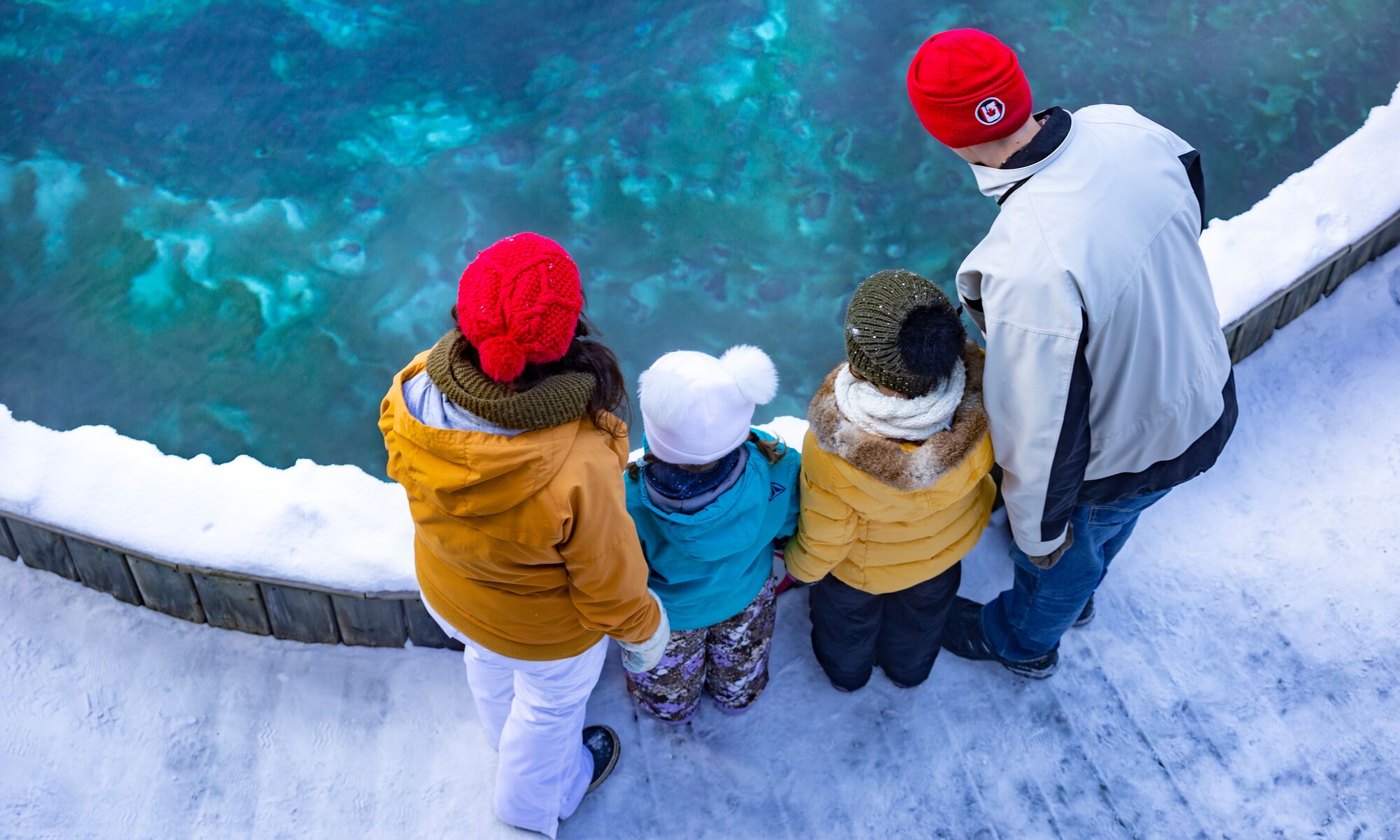 People look at a hot pool at the Cave & Basin in Banff National Park.