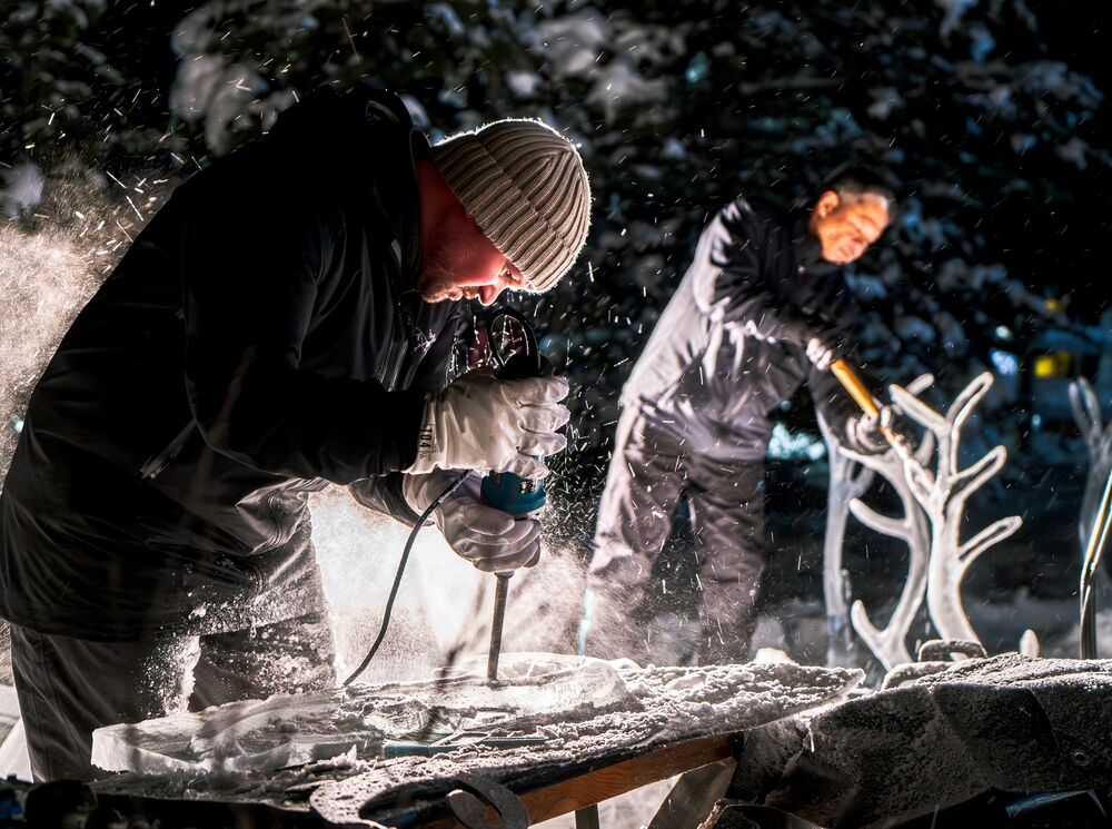 Two professional ice carvers during SnowDays in Banff and Lake Louise