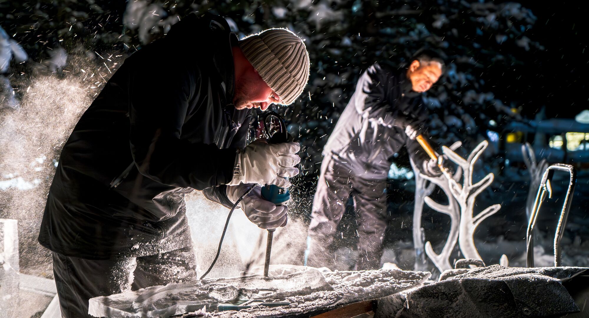 Two professional ice carvers during SnowDays in Banff and Lake Louise