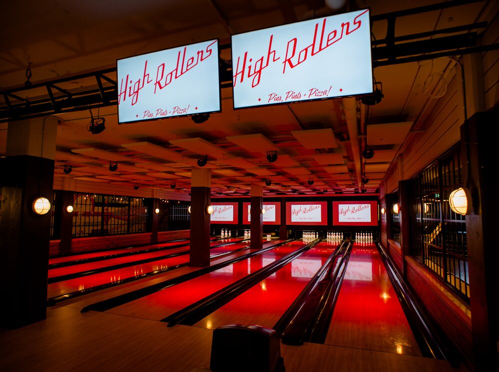 The bowling lanes at High Rollers in Banff, illuminated in red, in Banff National Park.