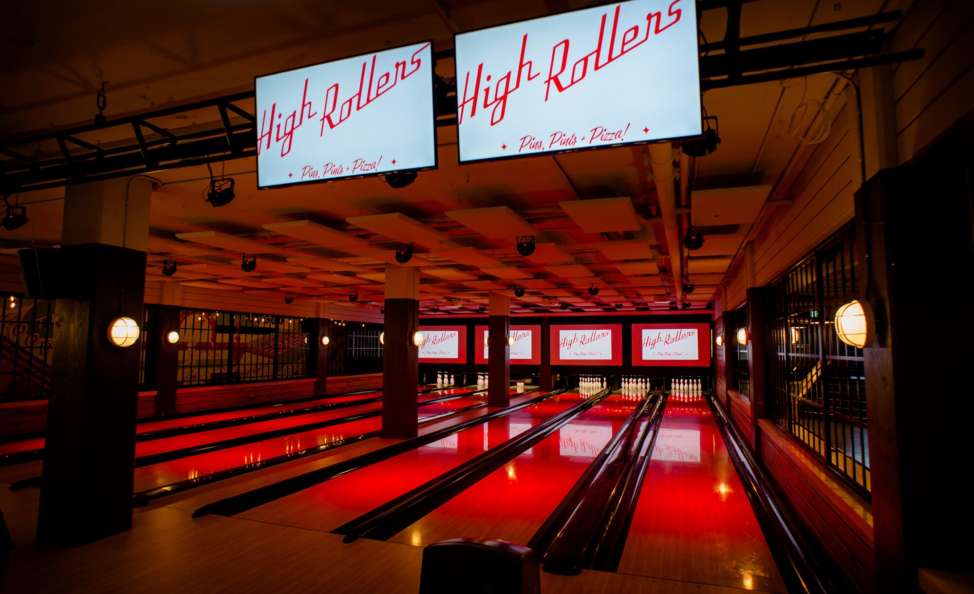 The bowling lanes at High Rollers in Banff, illuminated in red, in Banff National Park.