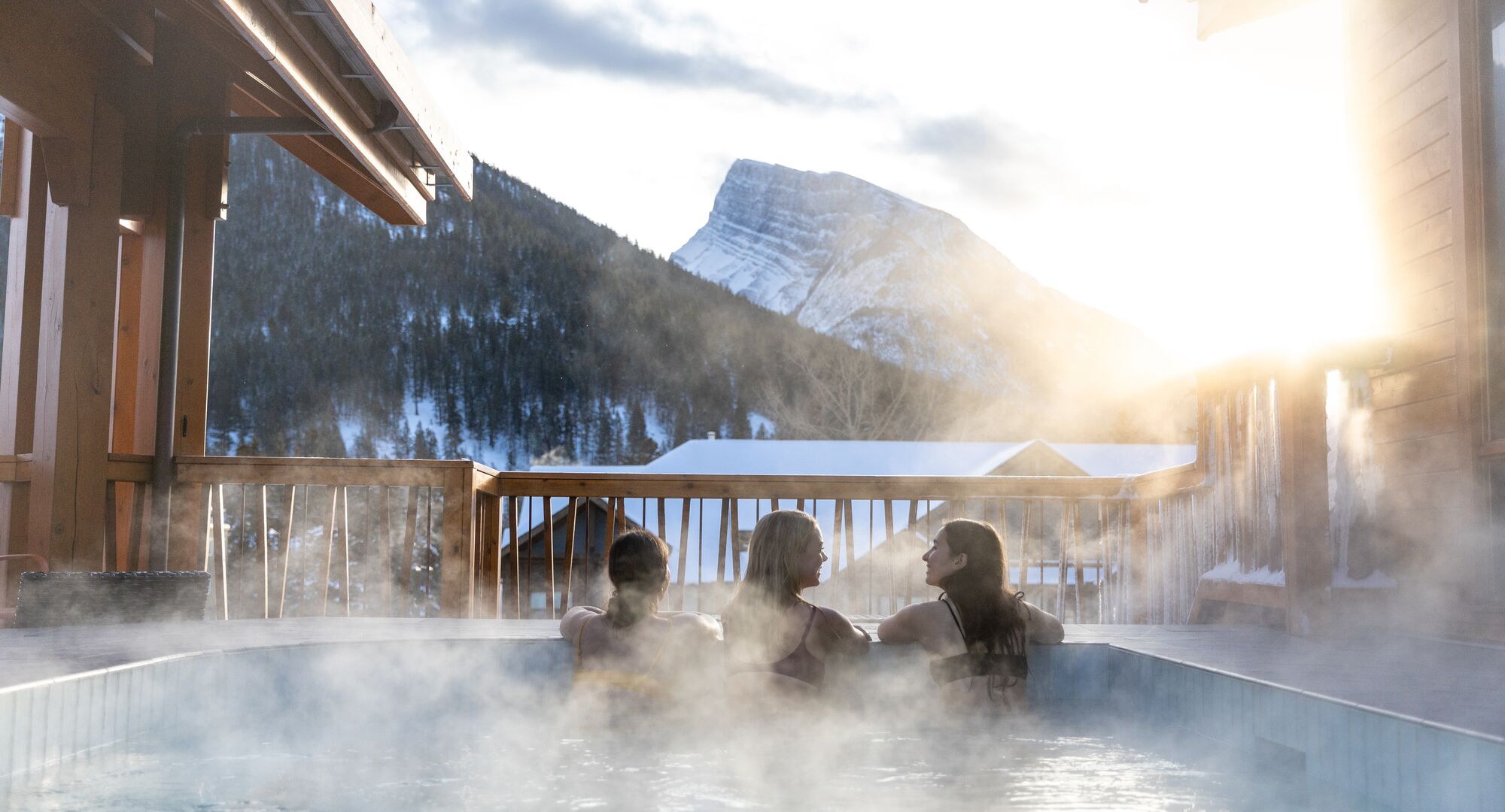 Outdoor Hot Tub on a balcony with winter mountains in the background