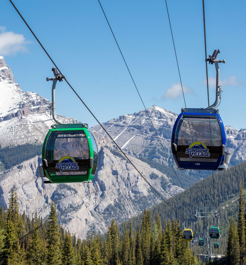 Gondola carts with mountains in the background at Sunshine Village in Banff National Parks