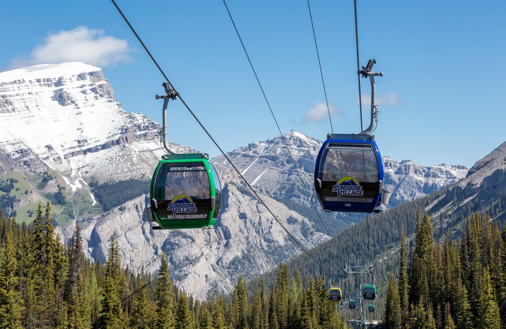 Gondola carts with mountains in the background at Sunshine Village in Banff National Parks