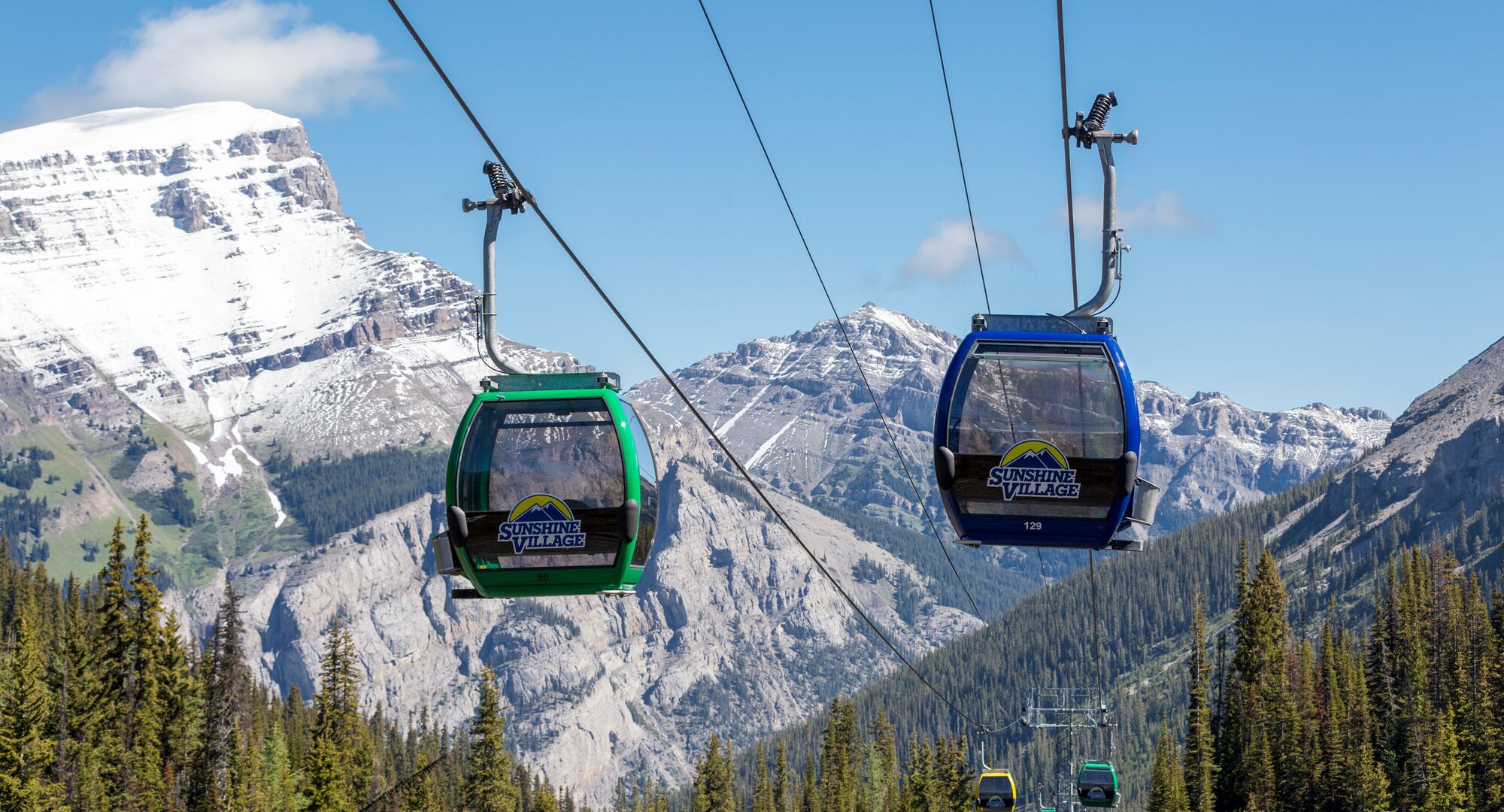 Gondola carts with mountains in the background at Sunshine Village in Banff National Park