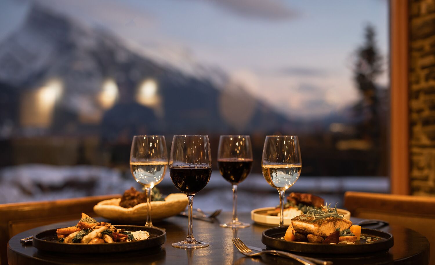 An elegant dinner table set up at plant-focused restaurant Juniper Bistro in Banff, Canada.