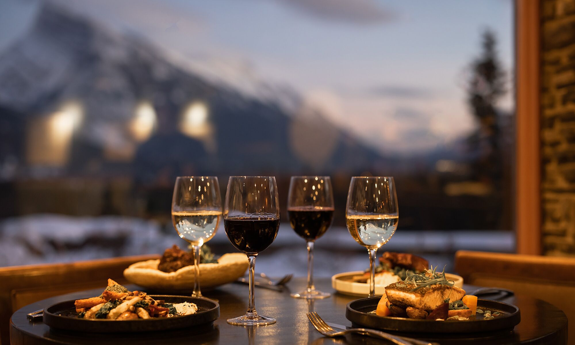 An elegant dinner table set up at plant-focused restaurant Juniper Bistro in Banff, Canada.