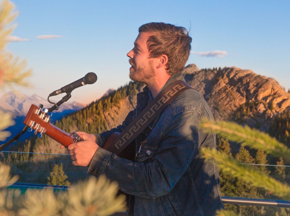 A man singing at the Banff Gondola Sunset Festival, a popular event in Banff in September