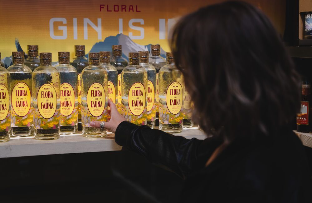 A woman shopping for gin at Park Distillery.