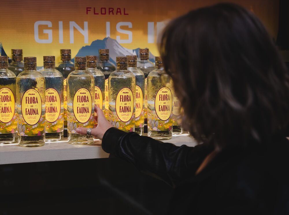 A woman shopping for gin at Park Distillery.