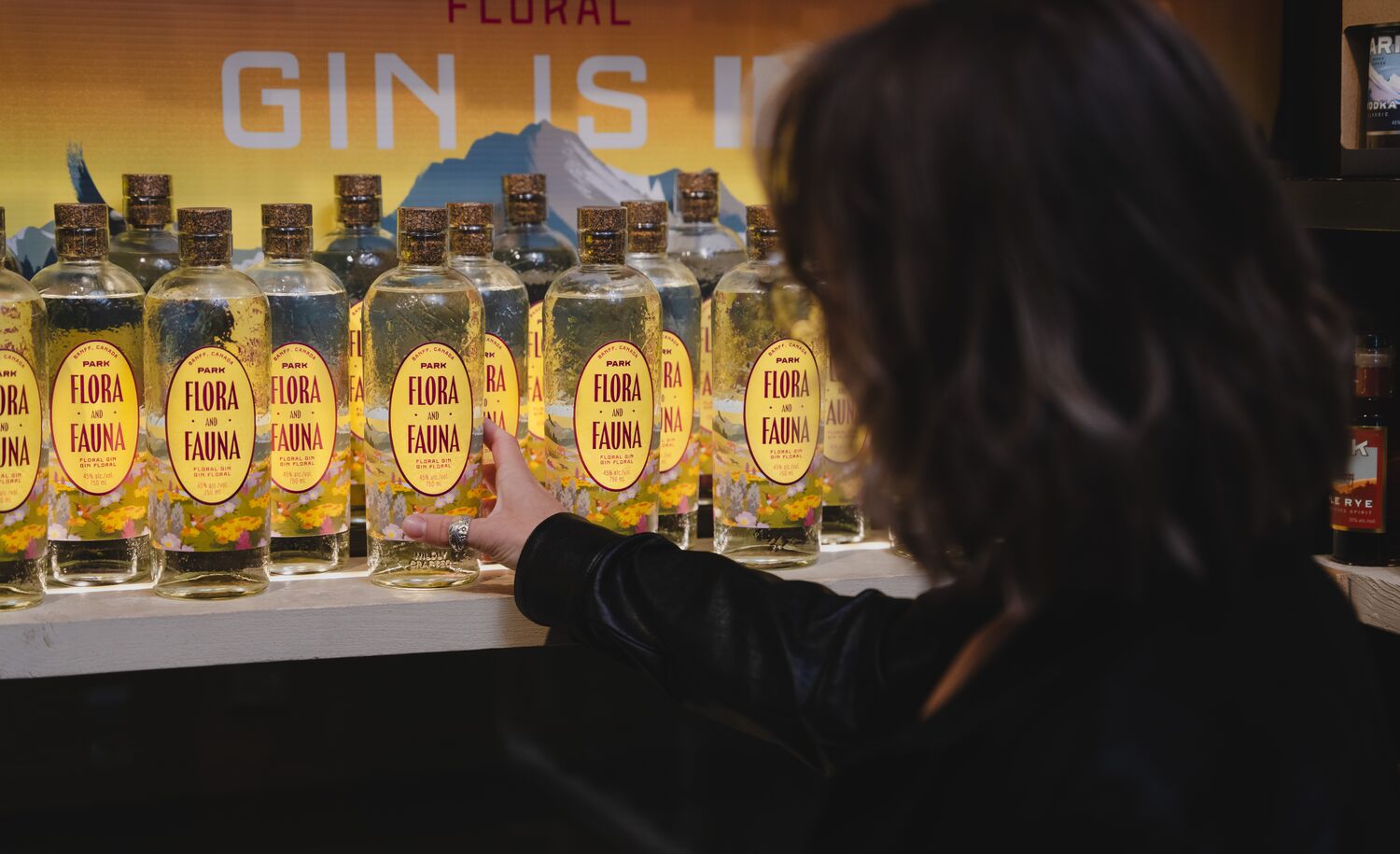 A woman shopping for gin at Park Distillery.