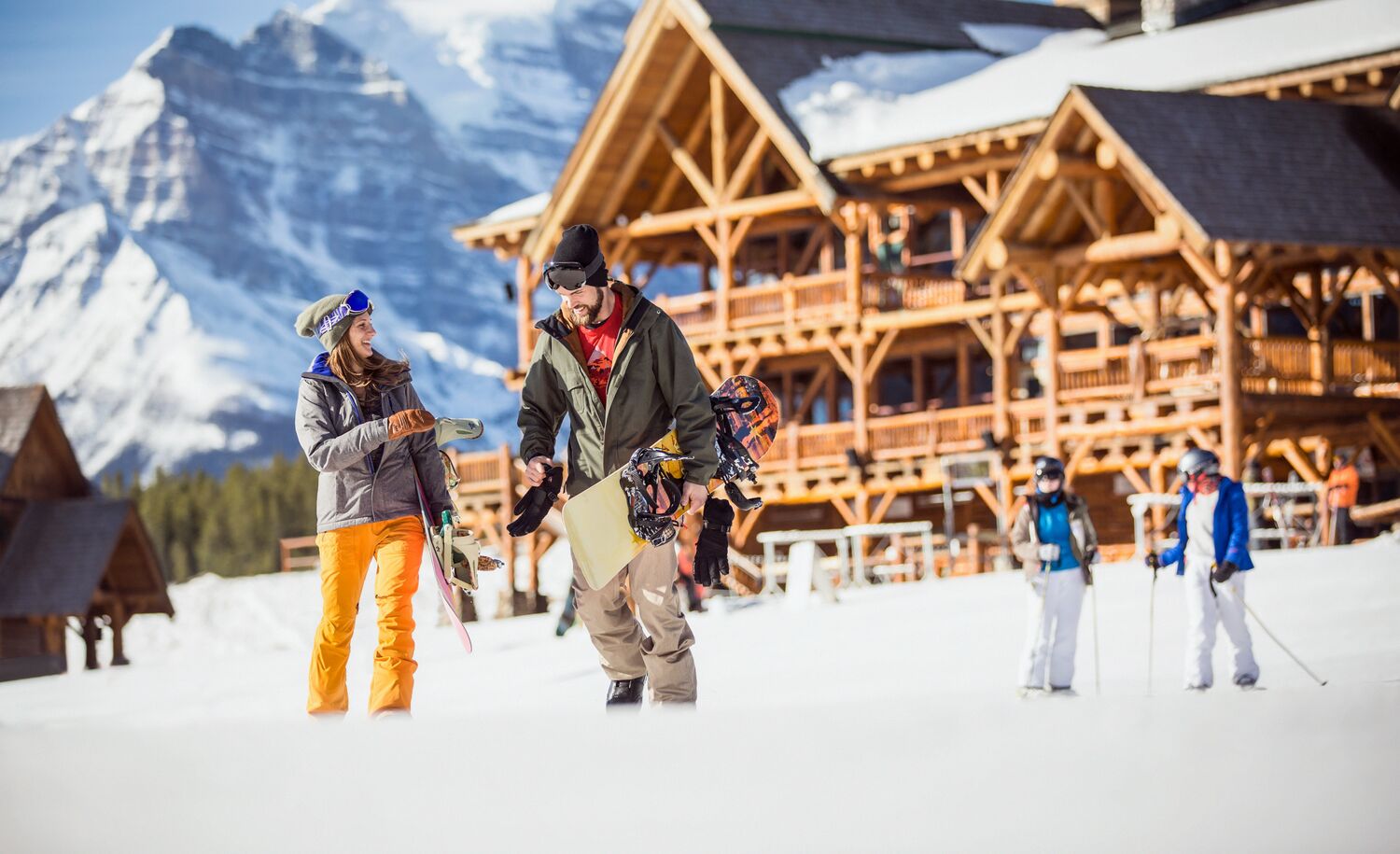 A couple walking and enjoying the cold winter day in Lake Louise Ski Resort.
