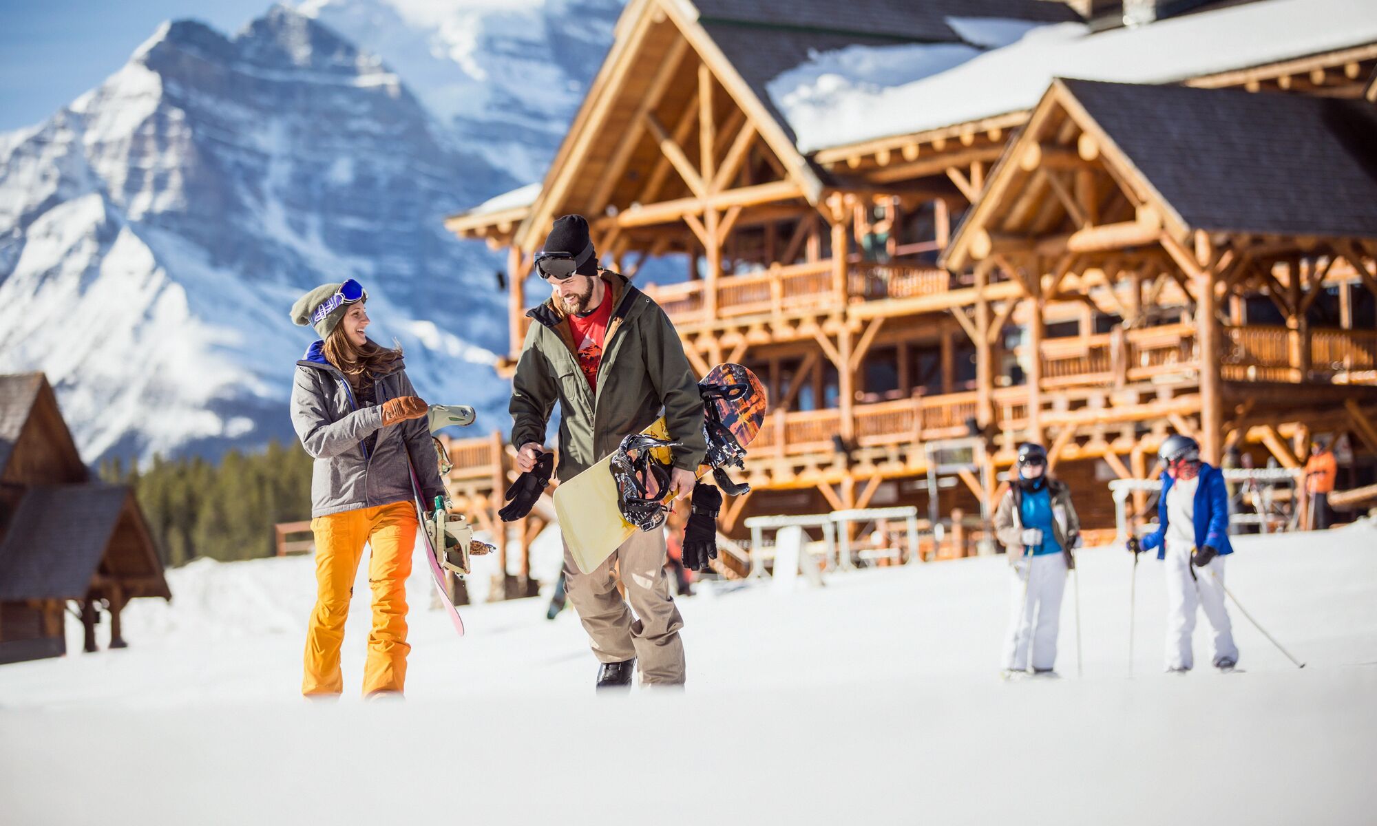 A couple walking and enjoying the cold winter day in Lake Louise Ski Resort.