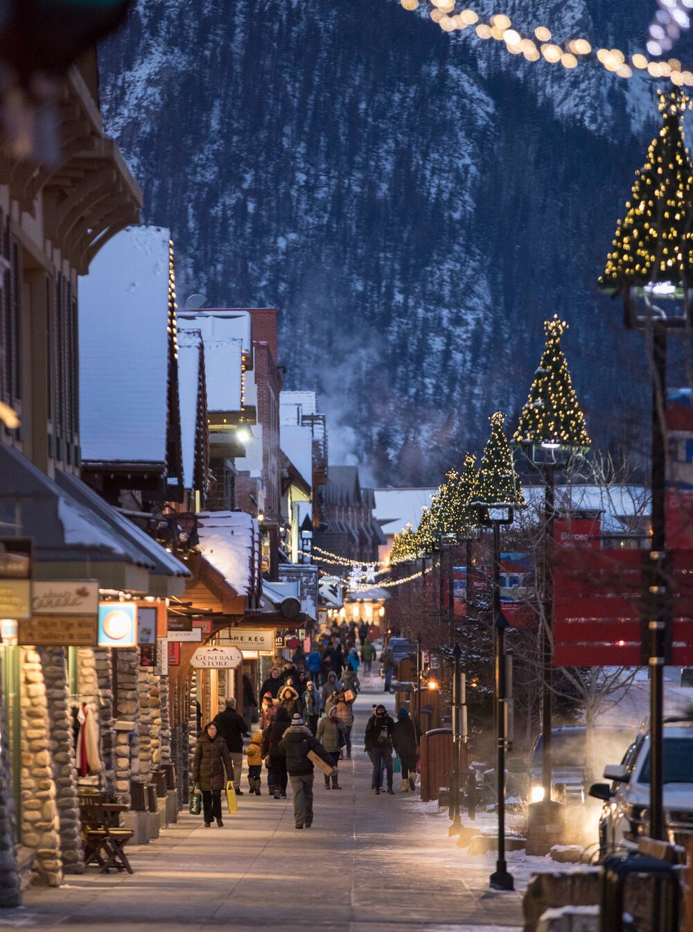 Banff Avenue in the Banff Townsite in Banff National Park in the winter during the holiday season.