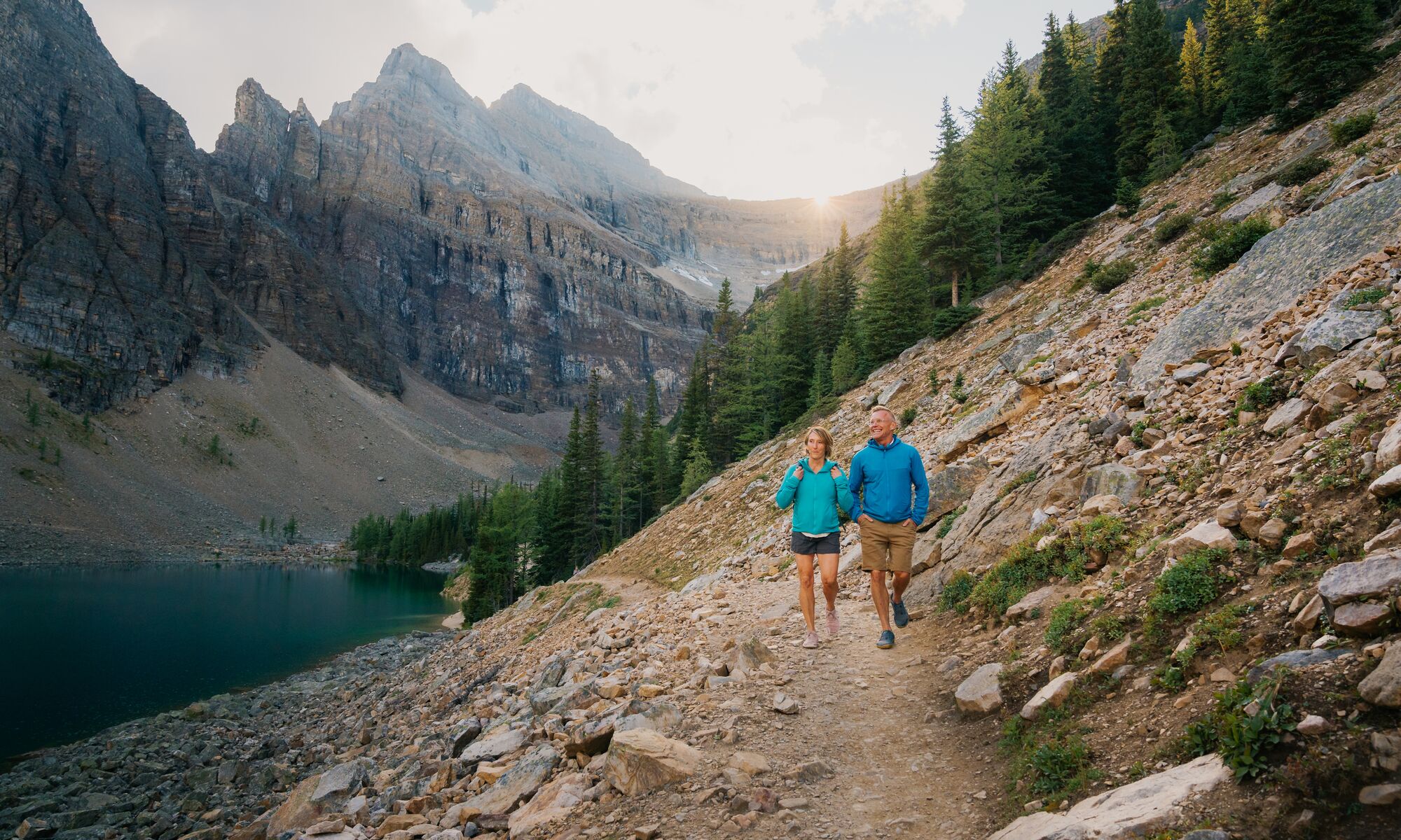 A couple hiking along Lake Agnes in Banff National Park