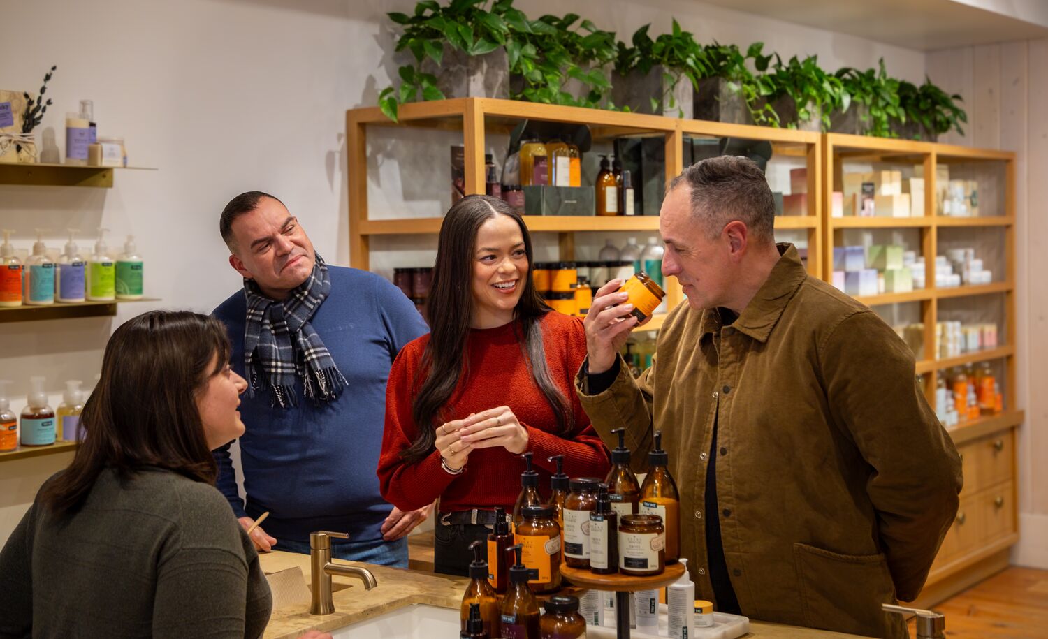 Friends smelling and trying products at Rocky Mountain Soap Company in Banff.