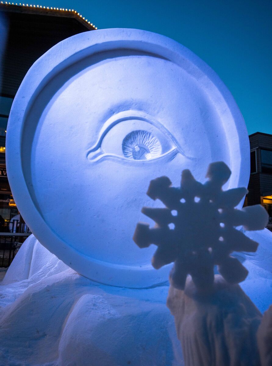 A snow sculpture of a magnifying glass on Bear Street during the SnowDays festival in Banff.