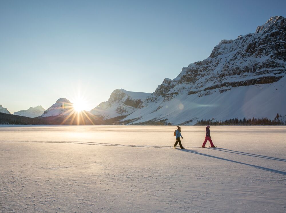 The couple enjoys their Snowshoeing experience at Bow Lake.