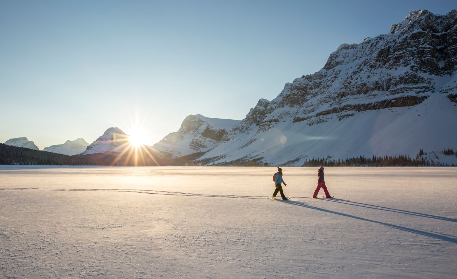 The couple enjoys their Snowshoeing experience at Bow Lake.