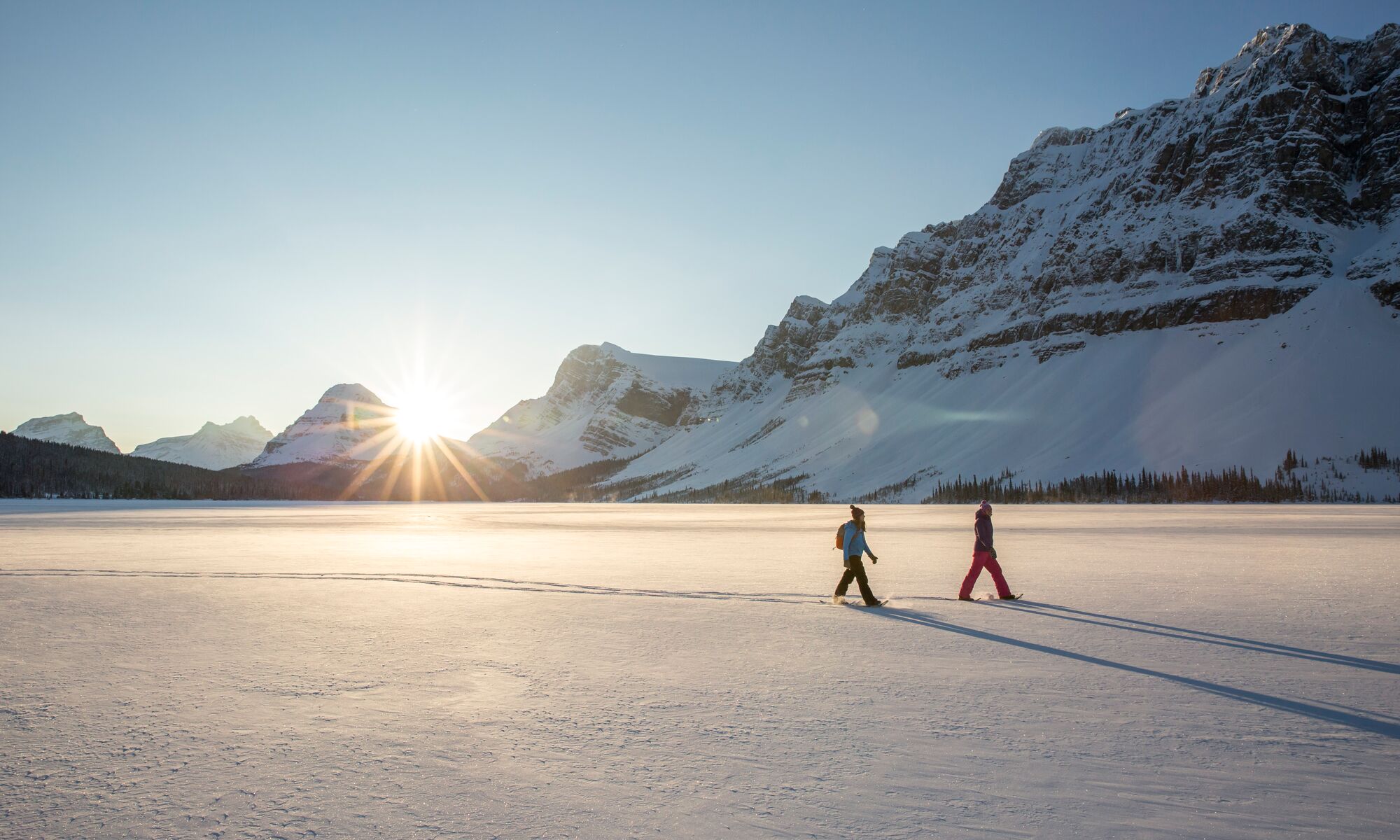 The couple enjoys their Snowshoeing experience at Bow Lake.