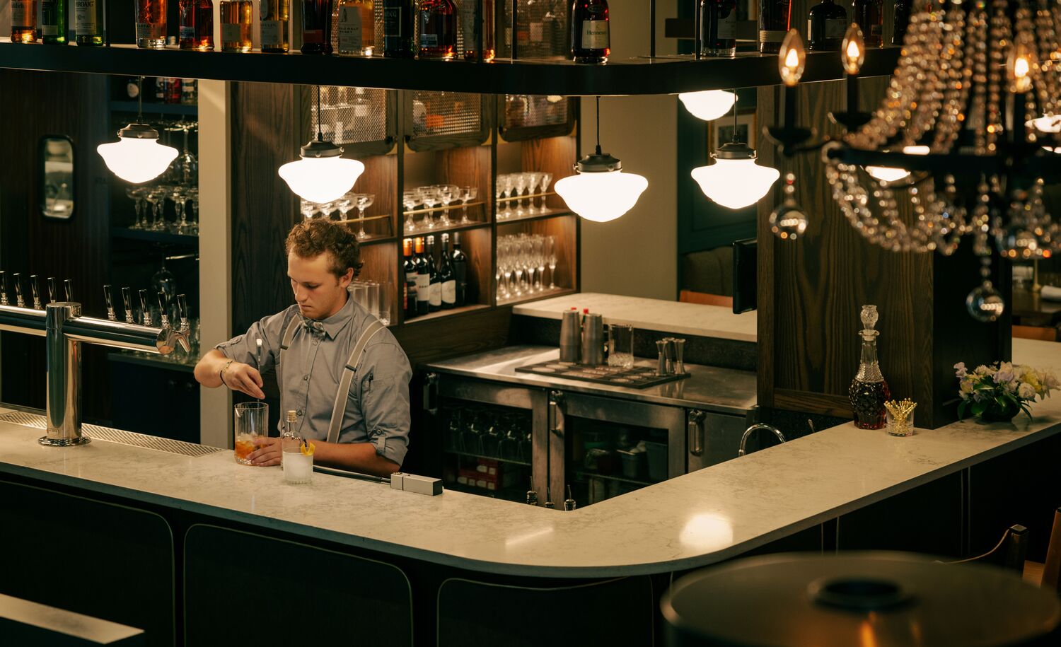 A bartender prepares drinks at Brazen, a restaurant located on Banff Ave in Banff National Park