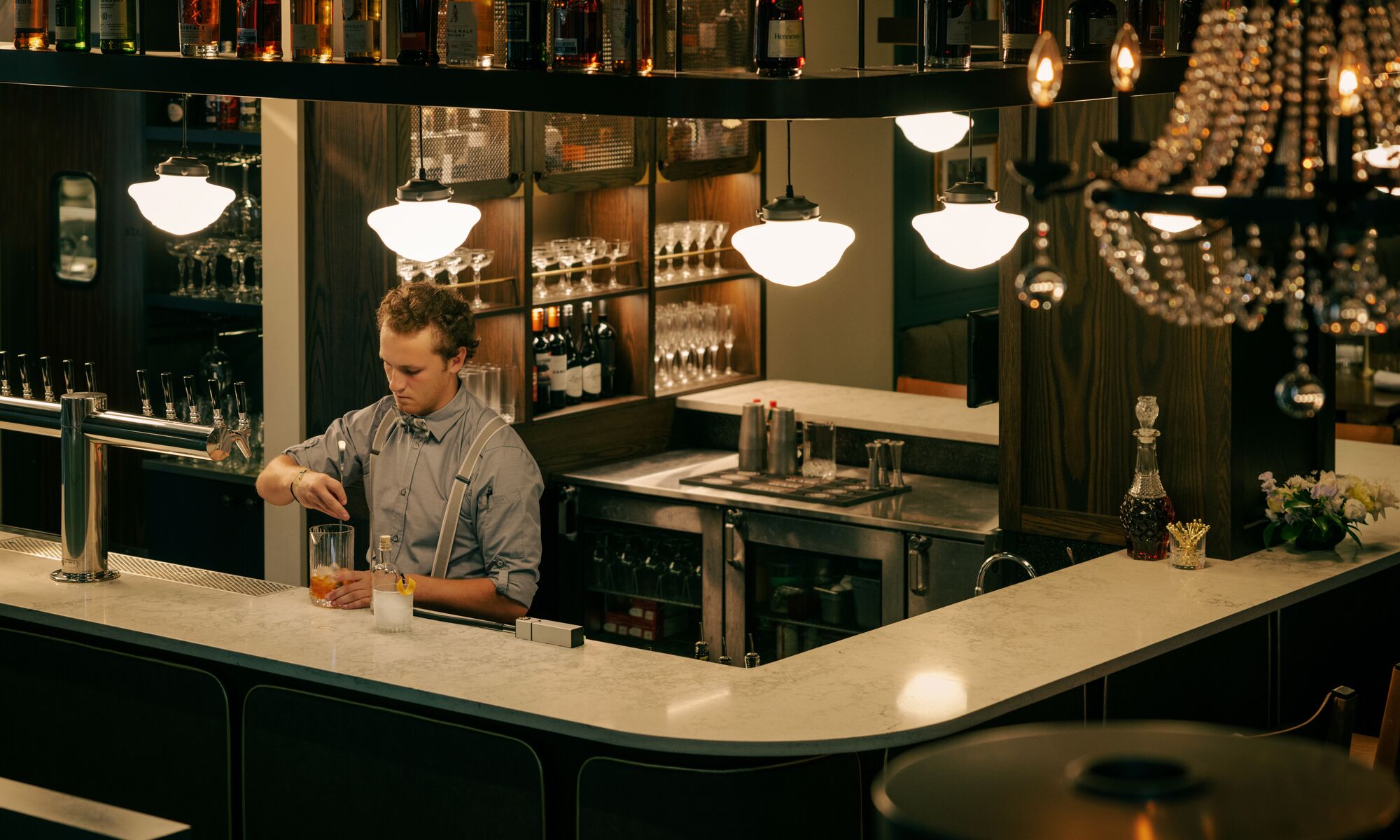A bartender prepares drinks at Brazen, a restaurant located on Banff Ave in Banff National Park