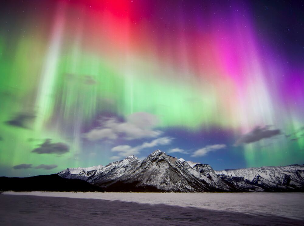 An aurora display over Lake Minnewanka in Banff National Park.