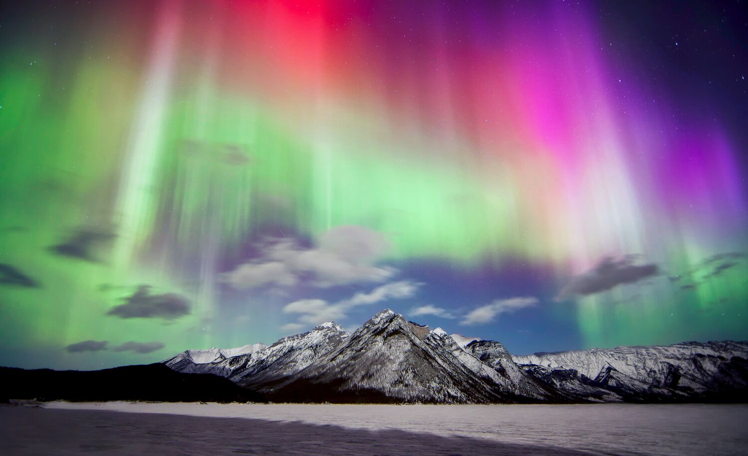 An aurora display over Lake Minnewanka in Banff National Park.