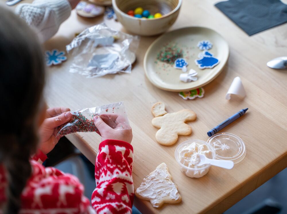 A child makes a Christmas cookie at Mountaintop Christmas in Banff National Park at the Banff Gondola.